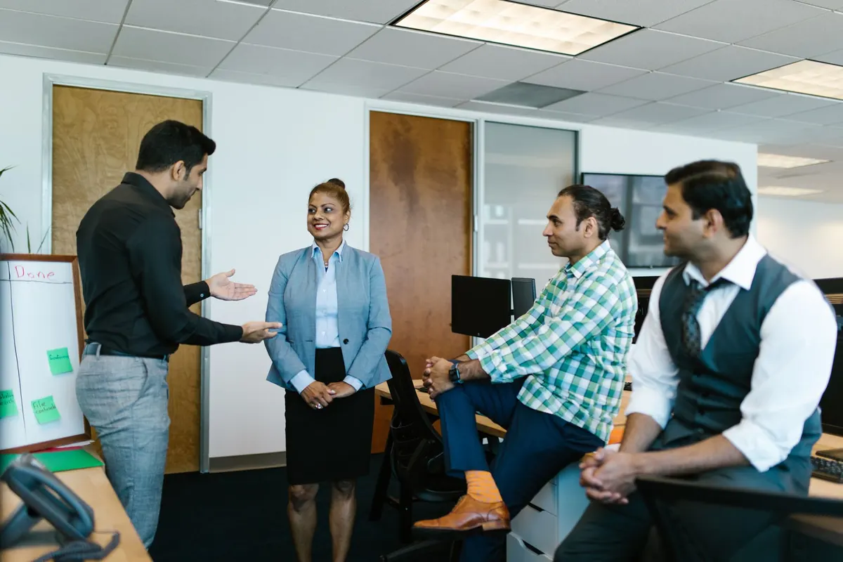 KYC Solutions consultants reviewing a hiring scorecard with a client team