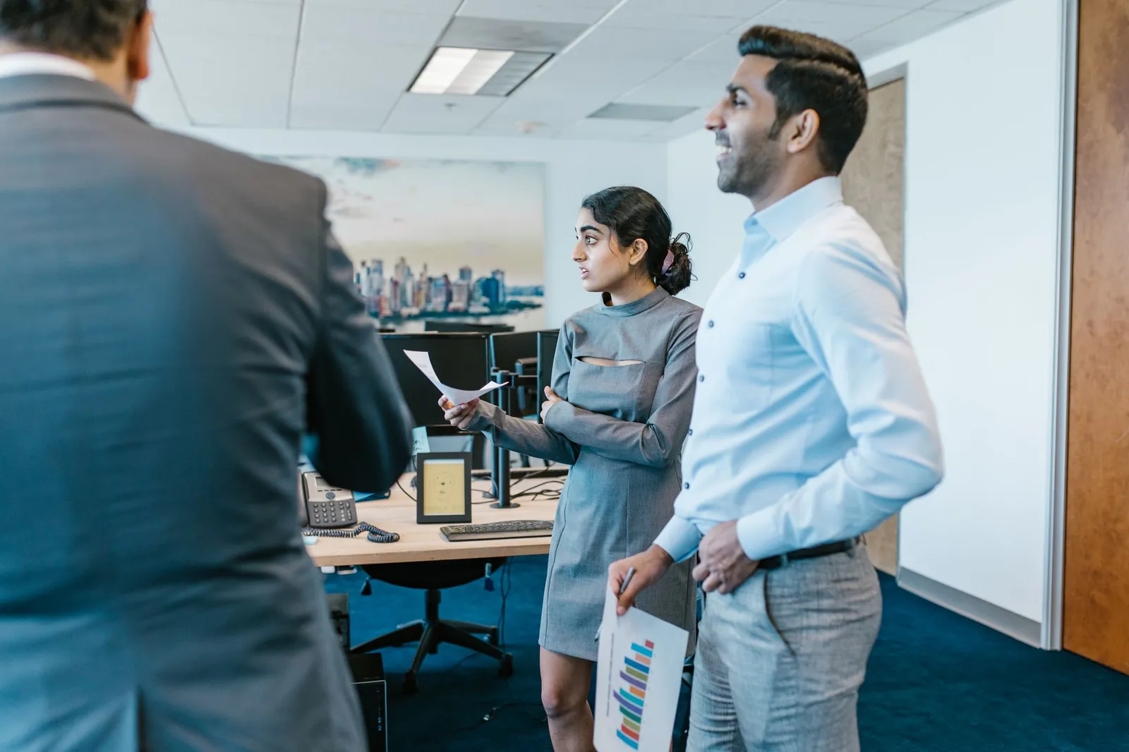 Two professionals talking through a role in a bright office